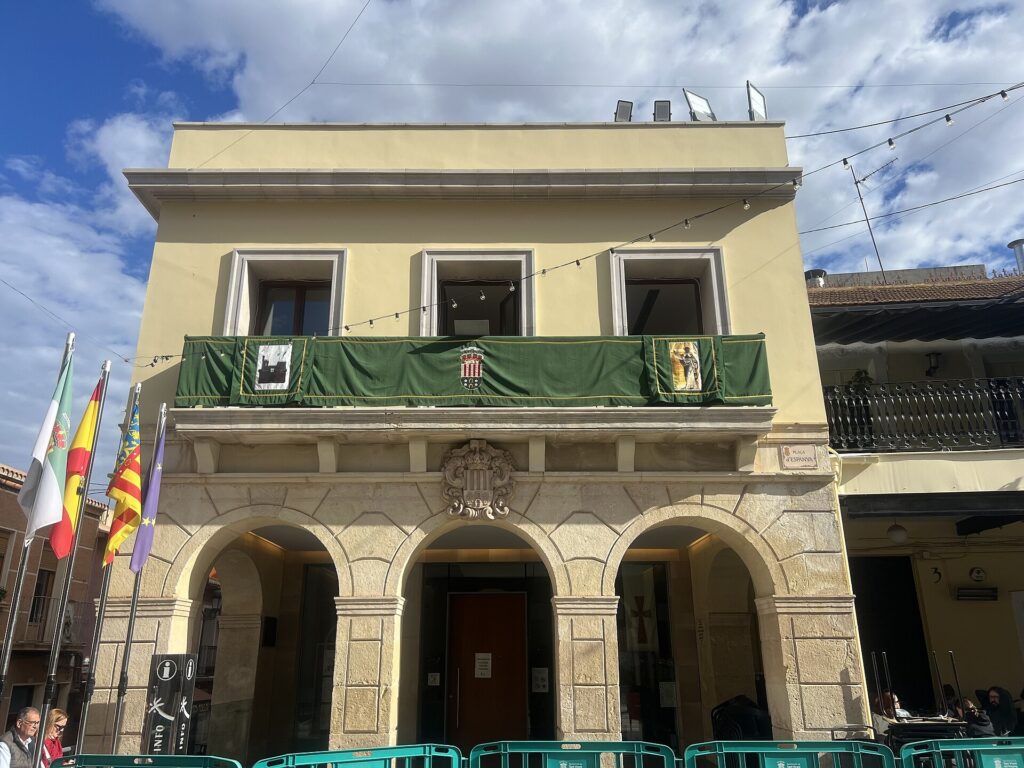 Old town hall on Plaza de Espana in Sant Vicent del Raspeig, decorated with flags for the patron saint festival