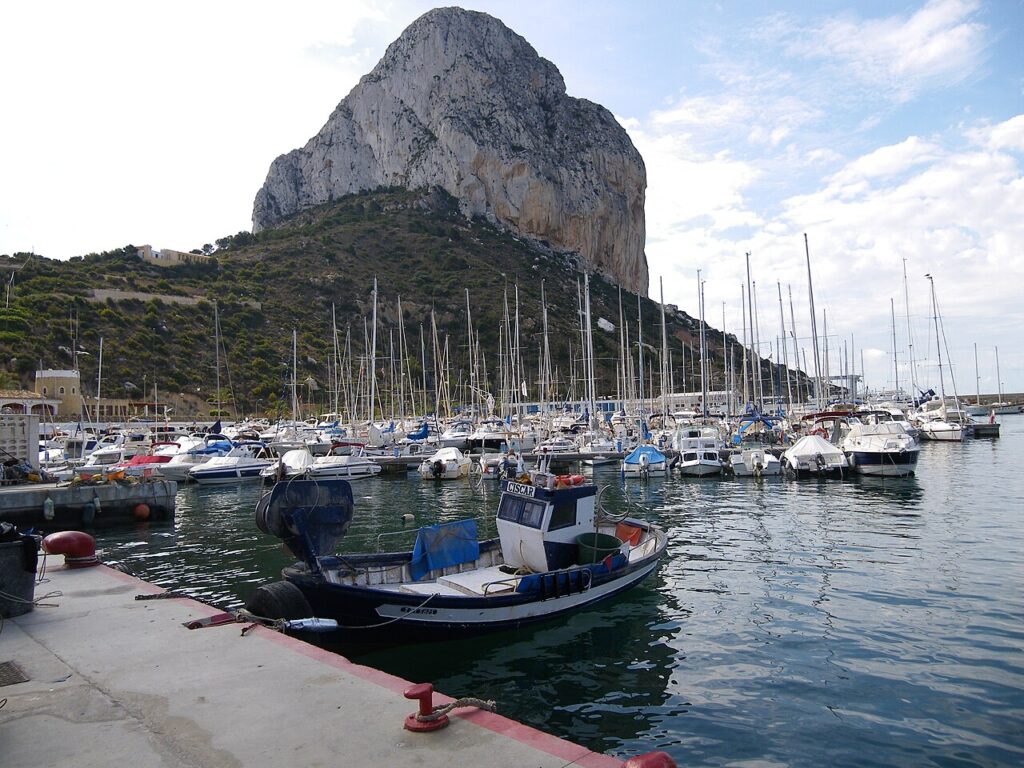 Fishing boats in the port of Calp below the towering Peñón de Ifach