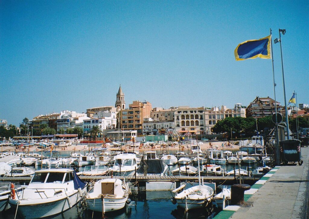 Harbour of Palamós with the town and church tower behind