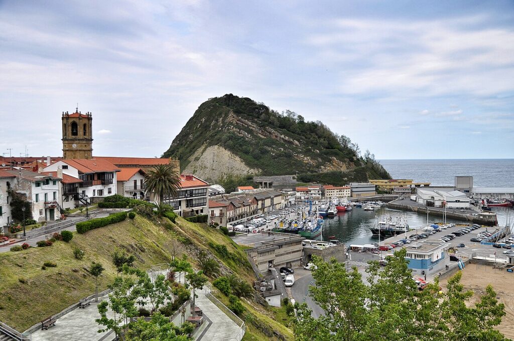 The fishing village of Getaria on the Gipuzkoa coast beneath Mount San Antón