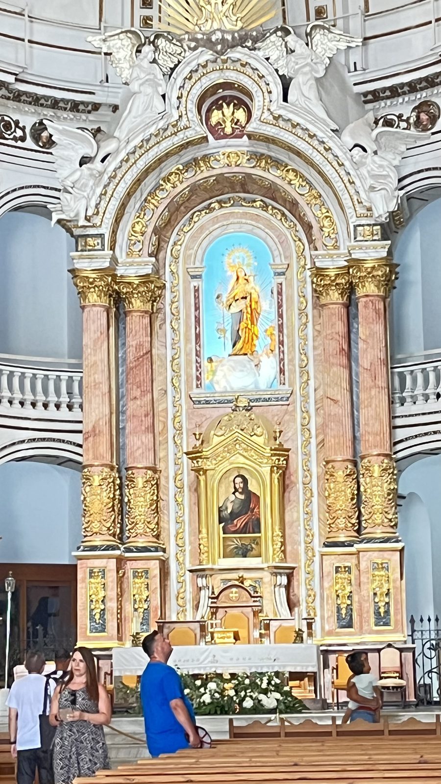 The gilded high altar of the church of Nuestra Señora del Consuelo in Altea, with the image of the Virgin above