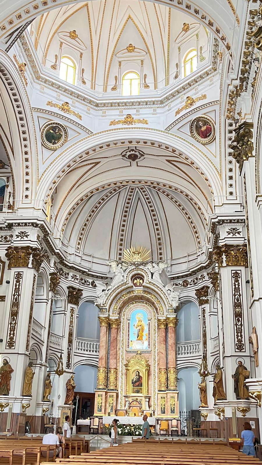 Interior of the church of Nuestra Señora del Consuelo in Altea, looking toward the dome and gilded high altar