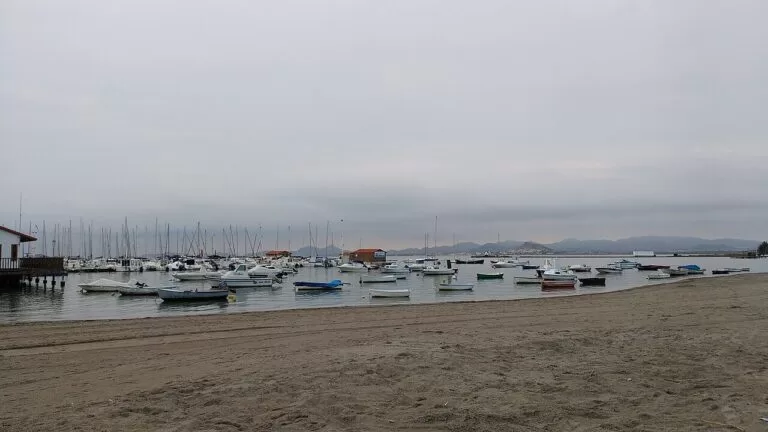 Boats moored off a sandy Mar Menor beach at Los Alcázares