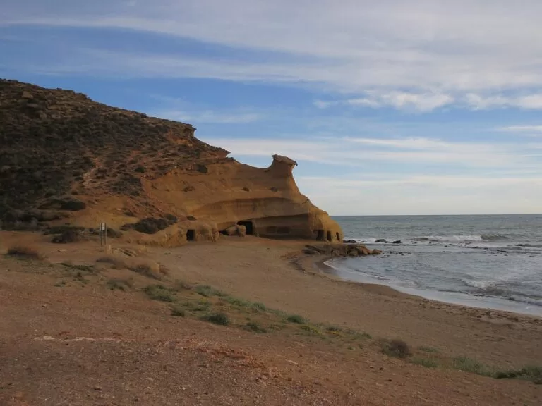 Golden sandstone cliffs around the cove of Los Cocederos in Las Cuatro Calas
