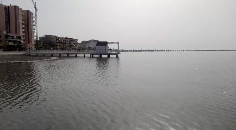 A wooden bathing pier reaching into the still Mar Menor at Villananitos