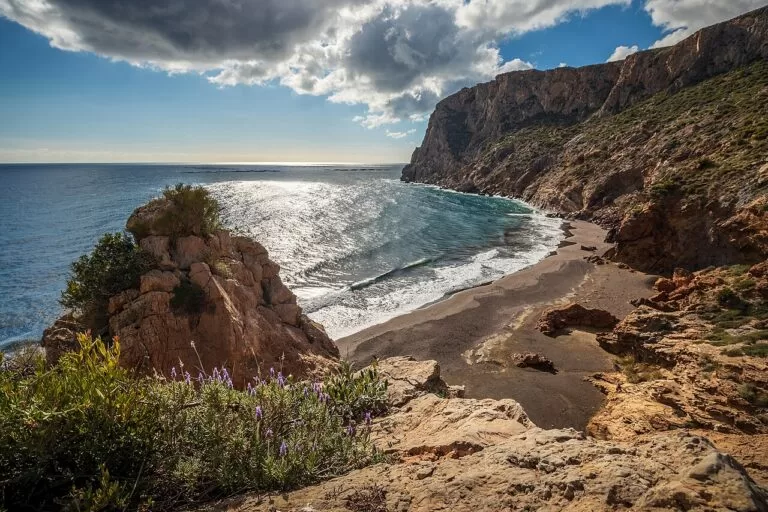 The rocky cove of Cola del Caballo on the coast of La Unión