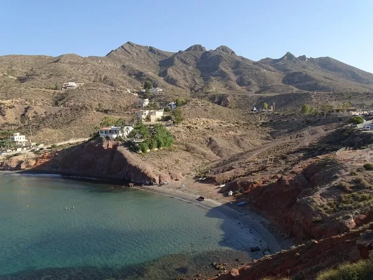 A small cove at Bolnuevo below the bare hills of the Sierra de las Moreras