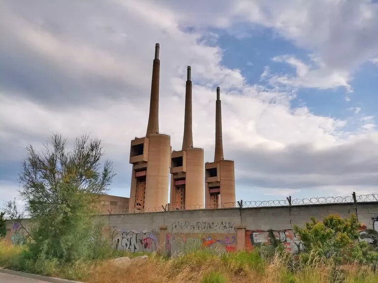 The three chimneys of the old Sant Adria power station by the coast