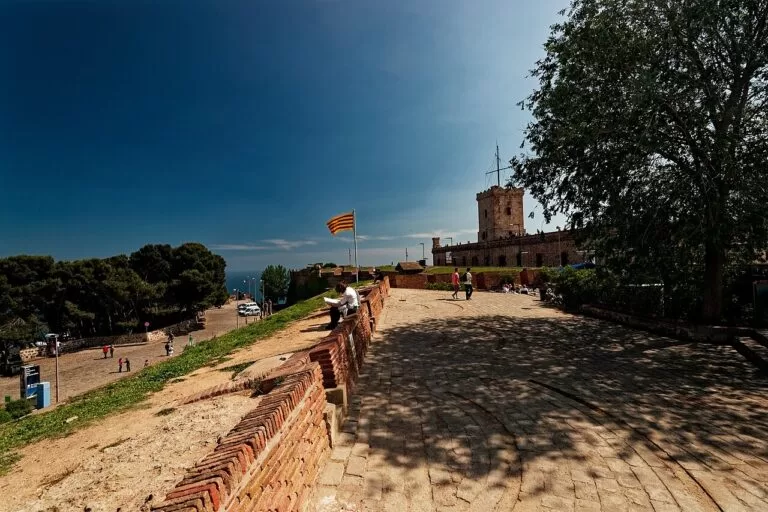 The stone ramparts of Montjuic Castle looking south