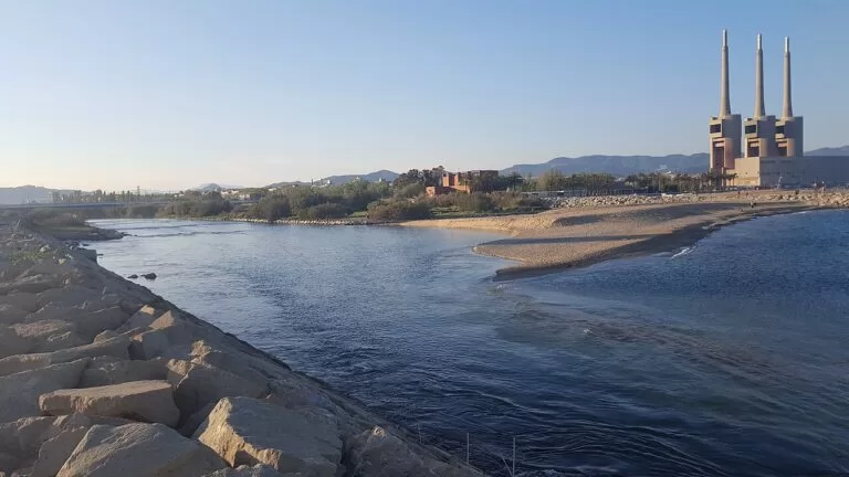 The mouth of the Besos river with the beach and the three chimneys