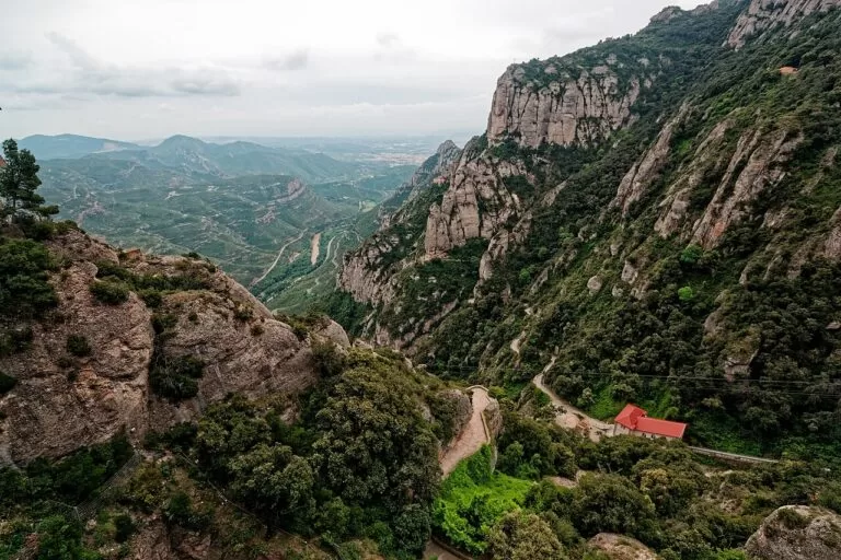 The serrated rock walls of Montserrat above a deep green valley